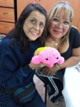 teacher and her deafblind student showing the fini