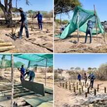 Construction crews remove and replace tent decks