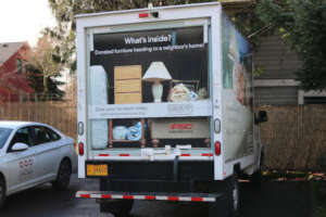 CW truck out in the city, picking up donations