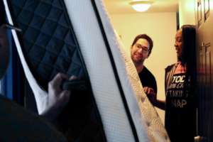 Warehouse staff deliver beds for Ramona's family