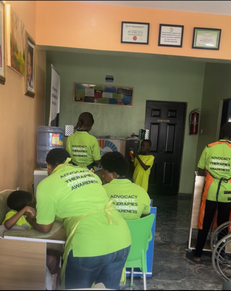 Caregivers feeding the children.