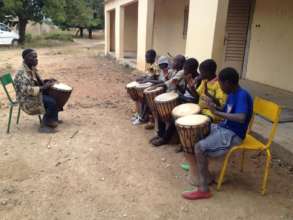 Beginners with djembe teacher Modibo Traore