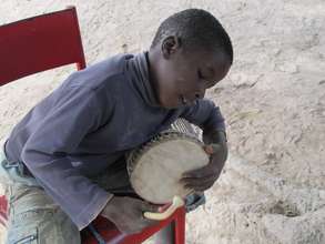 Percussion student in Kirina, Mali