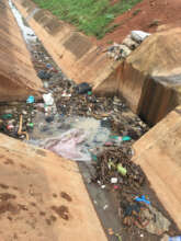 Gabbage Dumped in Water trenches during rainny day