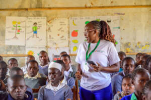 A HopeCore staff member providing MHM training to