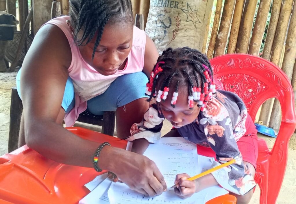 Mother and daughter working on motor skills
