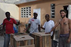 Youths and volunteers on a trash can project