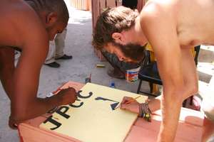 Volunteers and youths working together