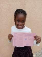 : A 6th grader excited about her good report card!
