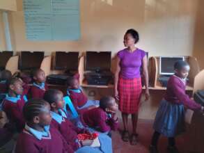 The girls in the digital library with staff member