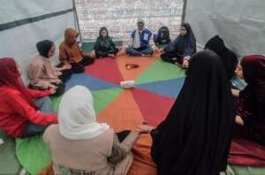 Adolescence do a meditation exercise in Gaza