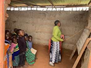 Children having a lesson in their temporary class