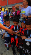 Children playing football in Catia