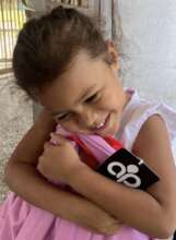 Isabel is ecstatic to receive her new backpack