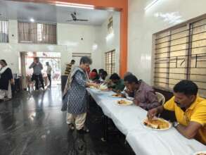 Founder Trustee serving food