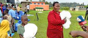 Woman speaks to the media on how mosquito nets