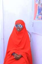 A young girl undergoing an eyesight measurement