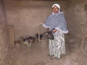 Zawadi showing her 7 chicken including 2 from YICE