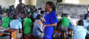 PLANE Peer Educator talking to fellow students