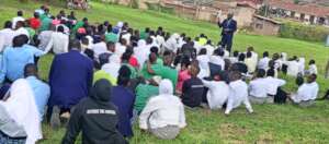 PLANE Official talking to students about HIV preve