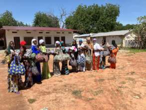 The women at the clinic receiving the baby bags.