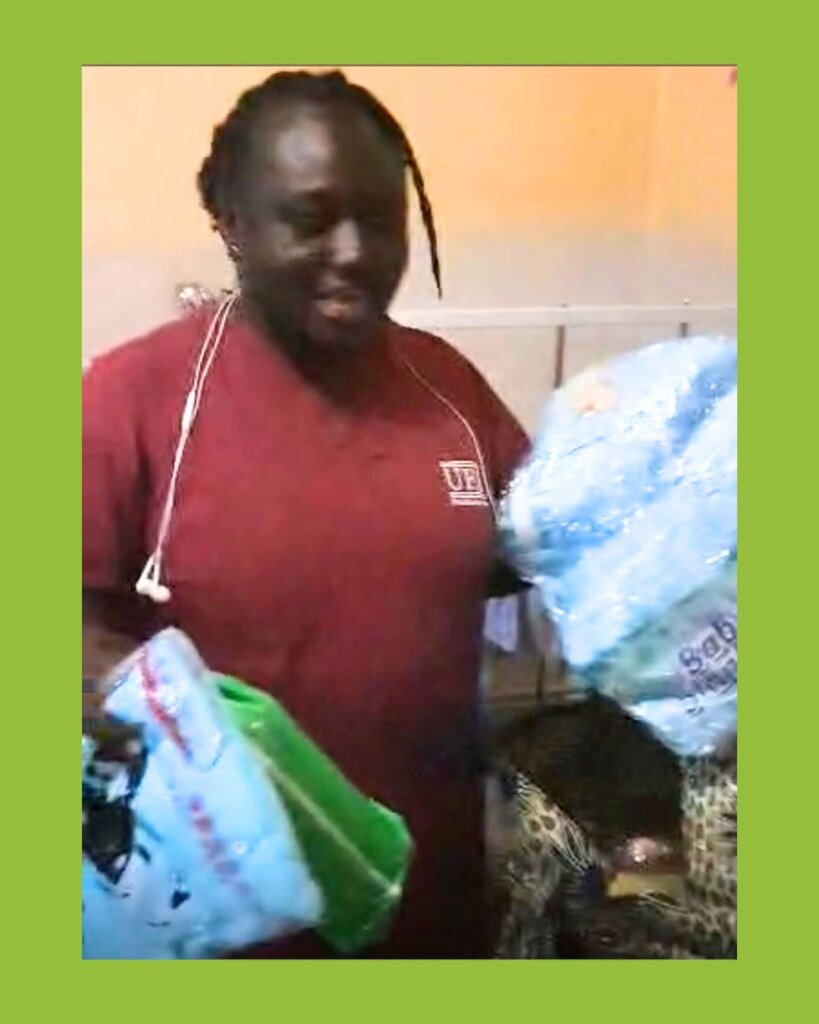 The midwife showing the baby bag contents.