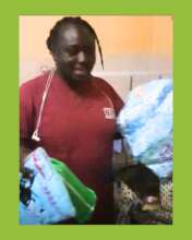 The midwife showing the baby bag contents.