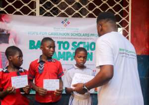 HfC Member Handing Tuition to IDPs at CHARIS