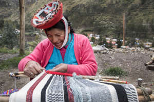 Juliana works on a new textile.