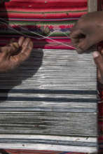 Two weavers of Patacancha weave together.
