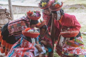 Companeras gather to review color sheets