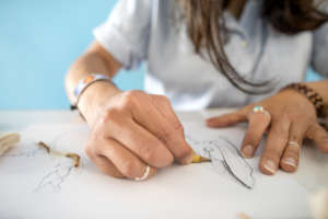Alejandra sketching for Kay Pacha collection