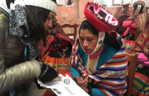 Alejandra works with Silvia on a new design.