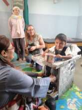 Adjusting an APT-manufactured chair in Nepal