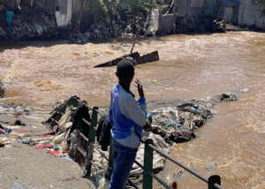 Mukuru Resident onlooks the flash floods