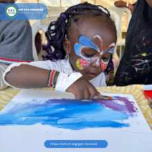 A girl painting on canvas