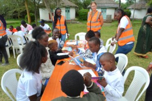 Children discuss on group paintings