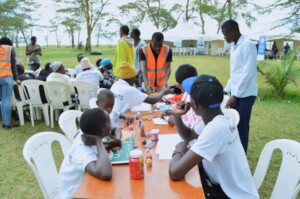 Children are paired into groups, for art painting