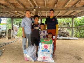 Ayib and family members receive food packages