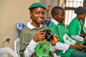 Hadiza with her camera, ready to win.