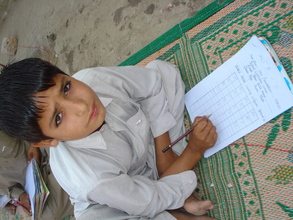 A child sitting for his final exams
