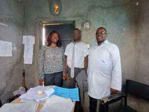 Counseling teachers and a beneficiary at school.