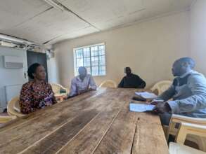 Mirai staff conversing with community volunteers