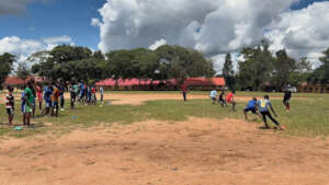 Receiving coaching from a football trainer