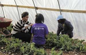 First Lady interacting with Growing Power youth.