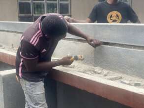 Installing water tanks at Kilmandafu primary