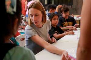 Volunteers working with the children