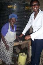 Monicah w/Mary Wangeci and her water tank