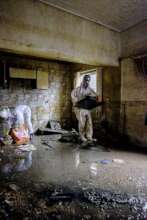 Volunteers mucking and gutting a flooded residence