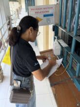 Head Midwife Marlene finalizing the paperwork